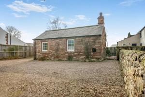 an old brick house with a stone wall at 1 Bed in Winskill oc-c36298 in Little Salkeld