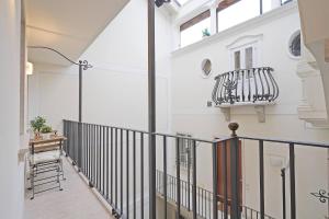 a hallway of a house with a balcony at Downtown Apartment - Gardagate in Salò