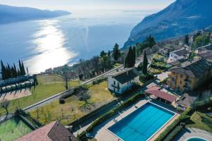 an aerial view of a town with a swimming pool at La Portella - Gardagate in Tignale