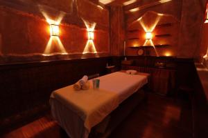 a room with a table and lights on the wall at Garni Hotel Leopold I in Novi Sad