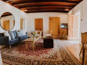 a living room with a couch and a table at Vleidam Guest Farm in Koringberg