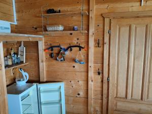 a room with a wooden wall withpokepokepokepokepokepokepokepokepoke at Beach House in Ulcinj