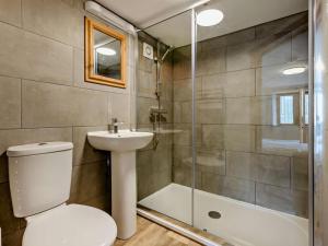 a bathroom with a toilet and a sink and a shower at 4 Bed in Bude oc-corys in Morwenstow +17 photos