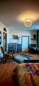 a living room with a couch and a table at chambre O'nids in Cahors +1 photo