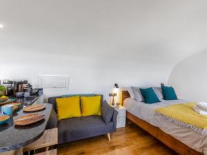 a living room with a bed and a couch at 1 Bed in Bude oc-88498 in Morwenstow