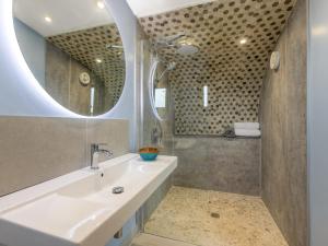 a bathroom with a sink and a mirror at 1 Bed in Bude oc-88498 in Morwenstow +14 photos
