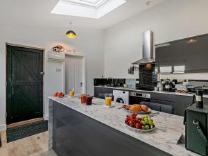 a kitchen with a counter with fruit on it at 1 Bed in Penzance oc-93410 in Sennen