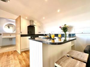 a kitchen with a large island in a room at 1 Bed in Bude oc-88499 in Morwenstow
