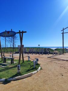 a park with a bunch of signs on the ground at Terramar condominium! Coral beach! in Tamoios
