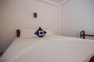 Katil atau katil-katil dalam bilik di Nico Beach Hotel