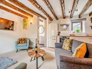 a living room with a couch and a table at 2 Bed in Bodmin oc-90216 in Bodmin +12 photos
