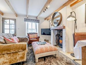 a living room with a couch and a fireplace at 2 Bed in Hayle oc-90552 in Phillack