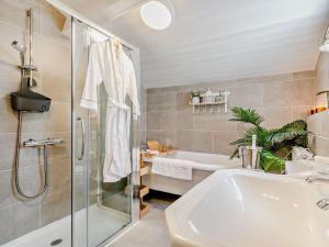 a bathroom with a shower and a sink and a tub at 2 Bed in Hayle oc-90552 in Phillack +14 photos