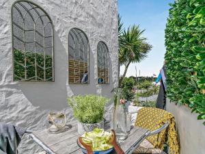 a table with a plate of food on a patio at 2 Bed in Hayle oc-90552 in Phillack