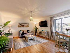 a living room with a couch and a table at 3 Bed in St. Austell oc-90218 in Charlestown