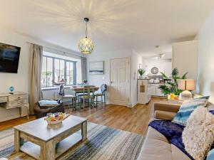 a living room with a couch and a table at 3 Bed in St. Austell oc-90218 in Charlestown