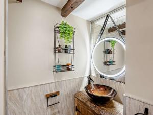 a bathroom with a sink and a mirror at 4 Bed in Bodmin oc-90215 in Bodmin
