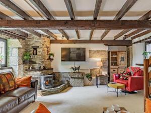 a large living room with a stone wall at 3 Bed in Bodmin oc-90217 in Bodmin