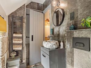 a bathroom with a sink and a mirror at 3 Bed in Bodmin oc-90217 in Bodmin +11 photos