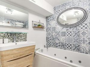 a bathroom with a tub and a sink and a mirror at 1 Bed in Bodmin oc-88165 in Bodmin +13 photos