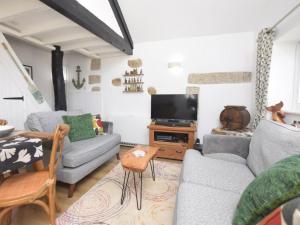 a living room with two couches and a tv at 1 Bed in Bodmin oc-88165 in Bodmin