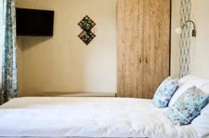 Postel nebo postele na pokoji v ubytování Páva Apartmanház
