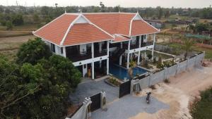 an overhead view of a house with an orange roof at Bayon Country Villa in Phumĭ Trás Treăng +164 photos