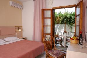 Ένα ή περισσότερα κρεβάτια σε δωμάτιο στο Hotel Calypso