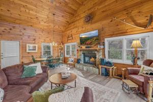 a living room with a couch and a fireplace at Scooby Shack in Blowing Rock