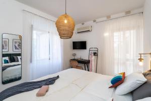 a bedroom with a large white bed and a mirror at Villa La Petra in Cavtat +26 photos