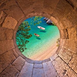 an aerial view of boats in the water under a bridge at Villa Ante - Private Pool, Wellness & Gym in Šestanovac