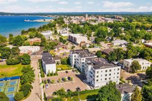 an aerial view of a city and the water at 1 Block to Beach | Bikes, Wellness & More in Traverse City
