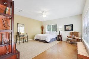 a bedroom with a bed and a table and chairs at Three Sisters - Casita 2 in Wimberley