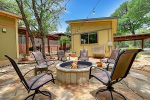 a patio with chairs around a fire pit at Three Sisters - Casita 2 in Wimberley