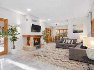 a living room with a couch and a fireplace at Casa del Capitán in Santa Ponsa