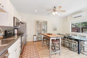 a kitchen with a table and some chairs in it at Three Sisters - Casita 1 in Wimberley