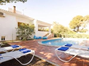 a villa with a swimming pool and some chairs at Casa del Capitán in Santa Ponsa +27 photos