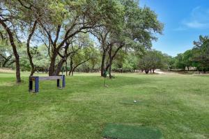 a golf course with a hole in the grass at Three Sisters - Casita 1 in Wimberley +10 photos