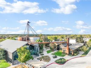 an aerial view of a building with a roller coaster at The Tilted Texan in Buda