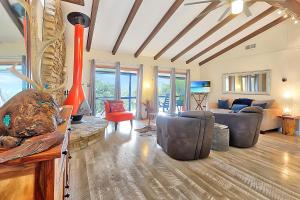 a living room with a couch and a fireplace at The Summit in Wimberley
