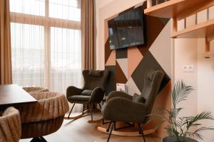 a waiting room with chairs and a table at Apart Marie-Therese in Umhausen