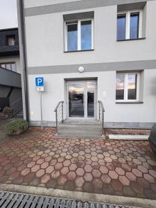 a building with a parking sign in front of it at Cozy Apartment - Netflix & Free parking in Žilina