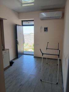 a empty room with a cart in the middle of it at Апартамент in Yerevan +3 photos