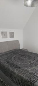 a bedroom with a bed with a carpet on it at Koblenz Asterstein Ferienwohnung in Koblenz