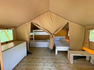 a bedroom with two beds in a tent at Bungalows Portuondo parking gratuito in Mundaka +150 photos