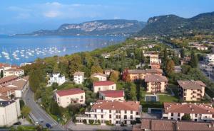 an aerial view of a town next to the water at Giardinello Apartments in Bardolino