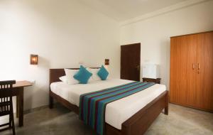 Katil atau katil-katil dalam bilik di Nico Beach Hotel