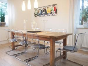 a dining room table with chairs around it at Weedkroog in Timmendorfer Strand