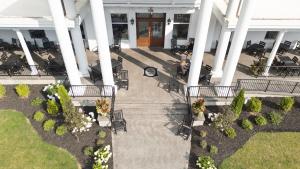 an overhead view of a porch of a building with tables and chairs at The White Inn in Fredonia
