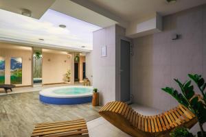 a large bathroom with a jacuzzi tub at HOTEL*** NAT Bukowina Tatrzańska in Bukowina Tatrzańska